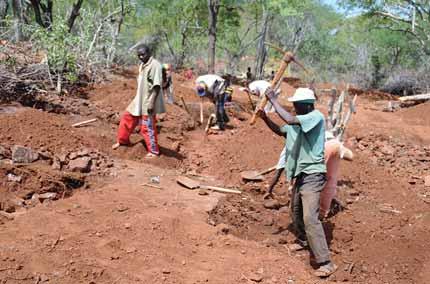 At least 5,000 miners have rushed to the deposit and are using hand tools to excavate shallow pits in eluvial soil (figure 36).