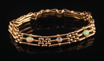 250 An opal and diamond mounted three-bar gate-link bracelet set with four circular old-cut diamonds each approximately 0.