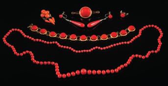 * 250-350 251 A collection of coral mounted jewellery to include a circularlink bracelet stamped K12, a single-stone bar brooch, a pair of