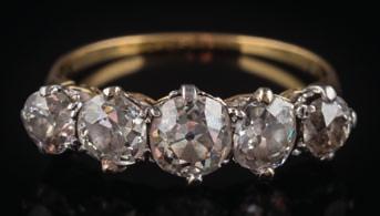 284 An 18ct gold and diamond single-stone ring with round old brilliant-cut diamond approximately 0.25cts in claw setting with hallmarks for Chester 1899, ring size O.