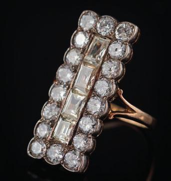 * 400-500 291 A diamond and step-cut diamond, rectangular panel cluster ring the central row of step-cut diamonds within a border of old brilliant-cut diamonds, total diamond weight approximately 2.
