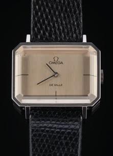 A gentleman s f300hz electronic gold plated wristwatch the brushed dial with baton numerals and hands, sweep seconds hand, date aperture, the winder with Omega emblem, the case approximately 35mm