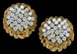 61 A PAIR OF DIAMOND CLUSTER EARCLIPS, 1960S, of circular form, the clusters of 29/30 brilliant-cut diamonds all claw set in white precious metal,