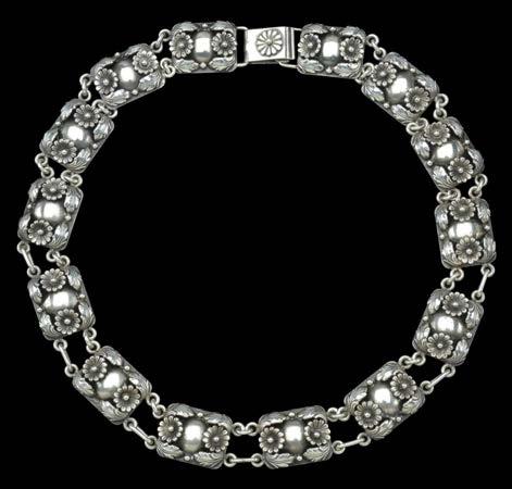 300-400 117 A SILVER BRACELET BY ROBERT LEE MORRIS, the chunky neo-cross design incorporating slightly concave cross-shaped panels between pairs of chain links, stamped with maker s mark RLM, and