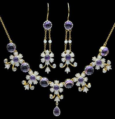 249 AN AMETHYST, PEARL AND DIAMOND FRINGE NECKLACE AND EARPENDANTS ENSUITE, the necklace composed of a central section of five flowerhead clusters with cabochon amethyst centres and spaced by larger