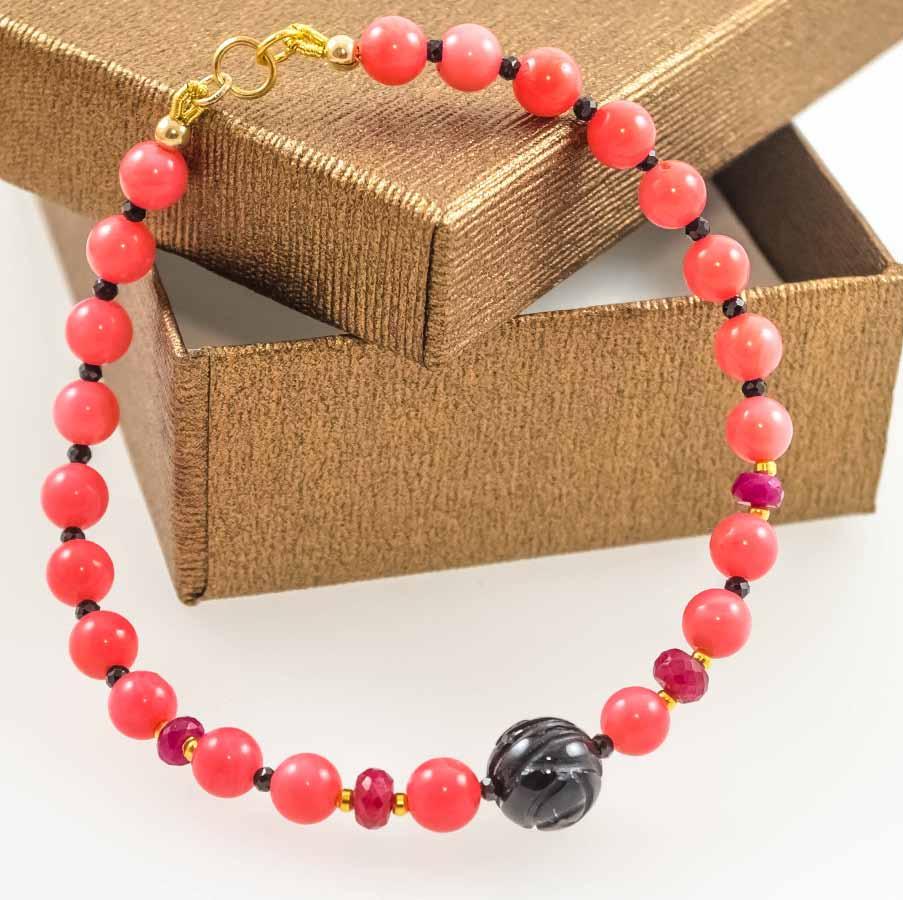 Pink Coral with carved Onyx,