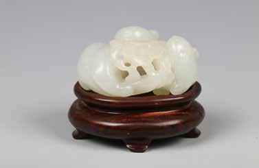Estimate CA$1,000 - CA$1,500 Estimate CA$1,200 - CA$1,800 135 18 世纪马上封猴白玉摆件 JADE HORSE WITH MONKEY PENDANT, QING DYNASTY A carving of a monkey on a horse's back, the stone of celadon tone with white