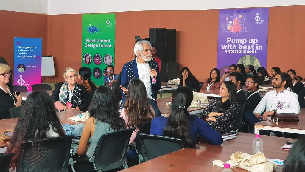 Sunil Sethi, pesident of the Fashion Design Council of India interacting with participants. participants to reinterpret the sketch for the new millennium.