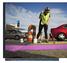 Artist and designer Joan Biddle paints the street at the corner of Granby Street and Brambleton Avenue, the gateway to the NEON arts district, on